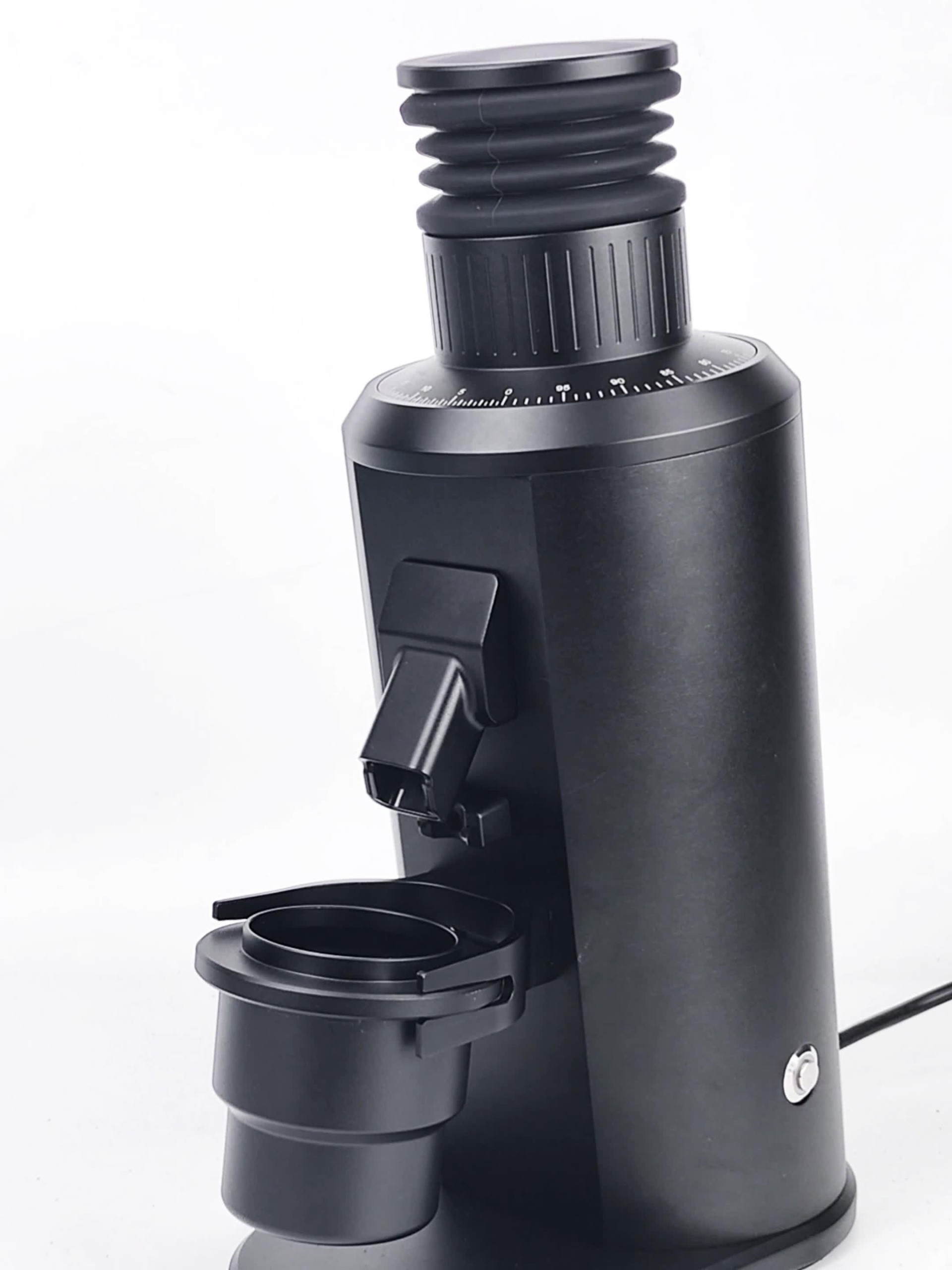 Black single dose flat burr coffee grinder with bellows hopper and dosing cup