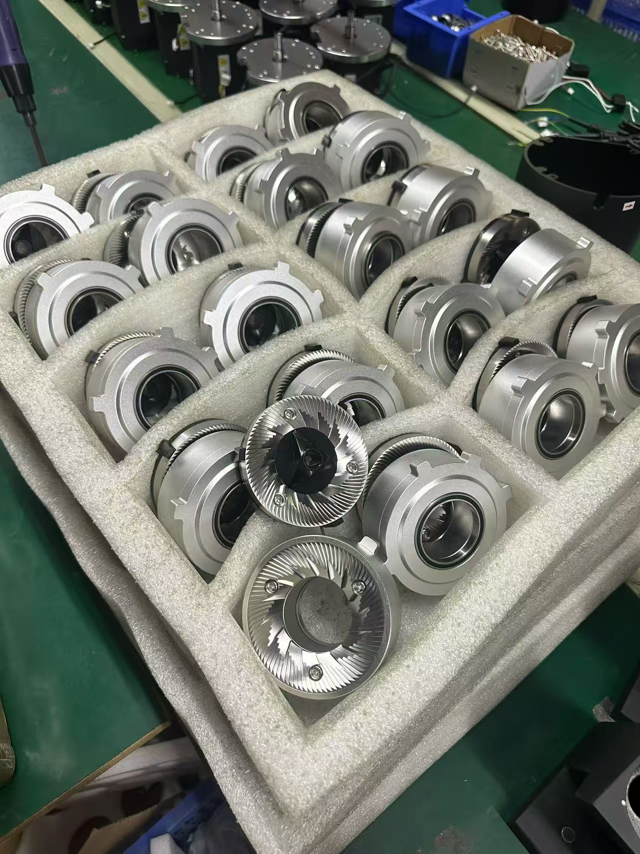 Coffee grinder burr components arranged in protective trays
