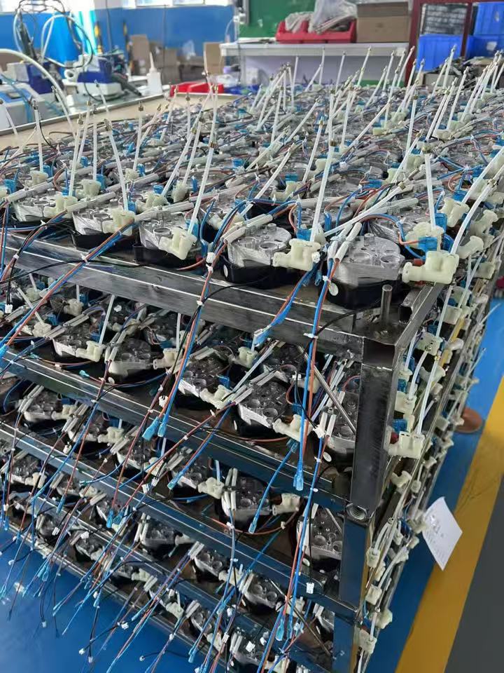 Appliance heating and fluid-control assemblies prepared for production